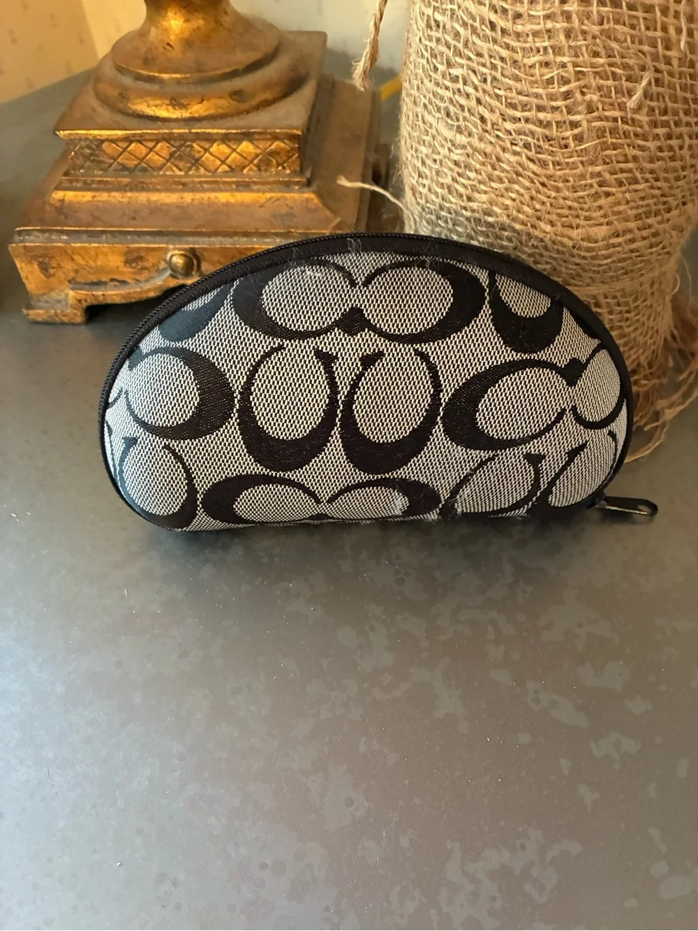 Coach Signature C pattern eye or sunglasses case. Zips, hard shell. 6.5 wide.
